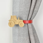 Wooden tractor shaped curtain tieback