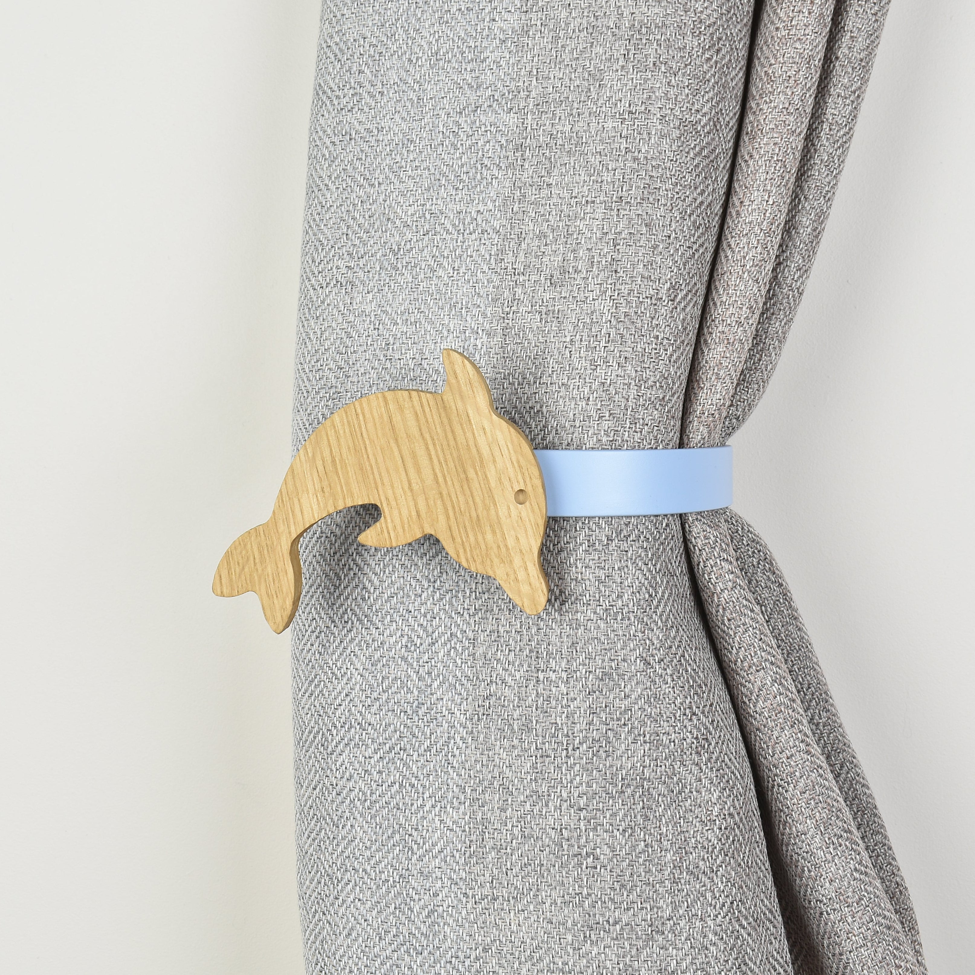 Wooden dolphin shaped curtain tieback
