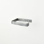 pewter metal toilet roll holder with a white background