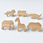 Set of six handmade oak safari animal drawer knobs including lion, rhino, crocodile, elephant, giraffe and hippo