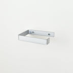 silver metal toilet roll holder with a white background
