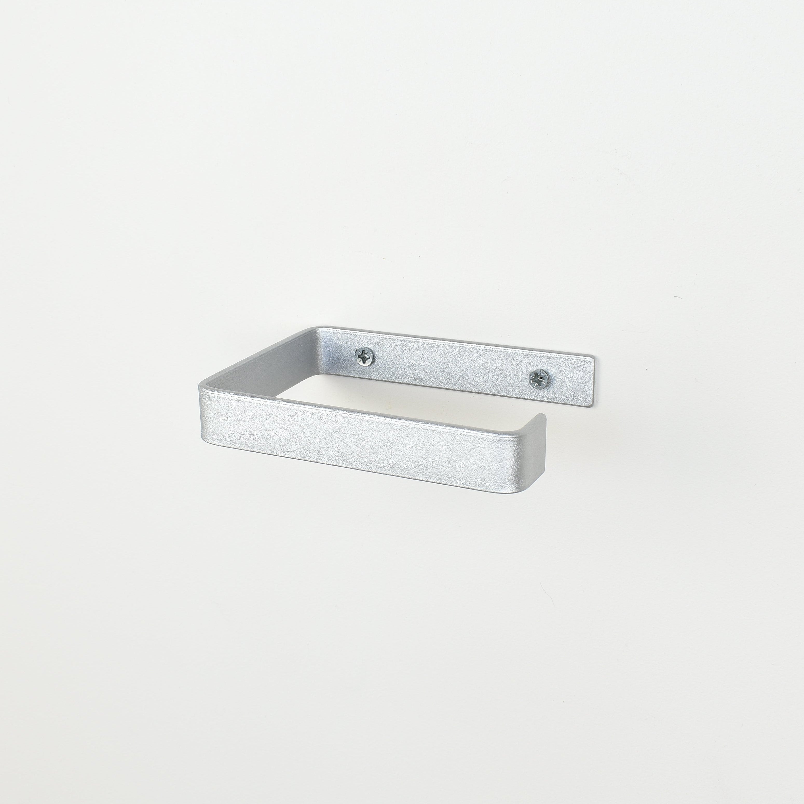 silver metal toilet roll holder with a white background