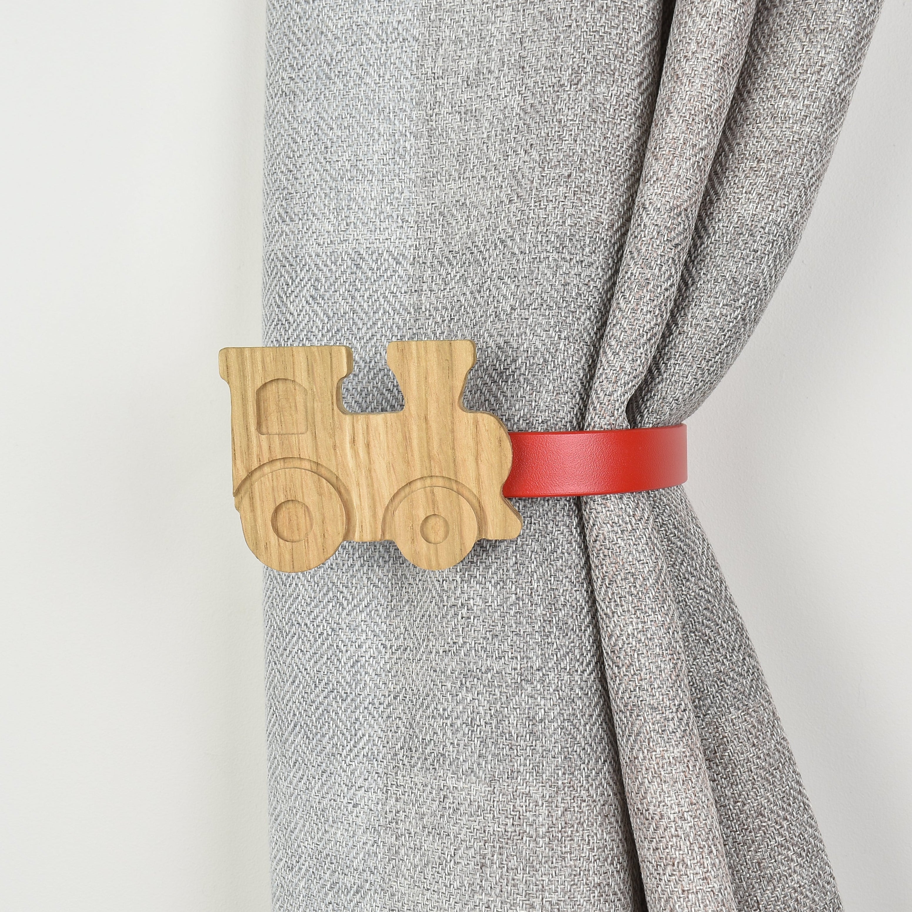 Curtain tieback with wooden train design